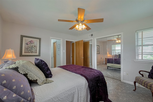 bedroom featuring carpet floors, baseboards, visible vents, and ceiling fan