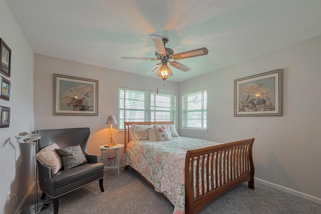 bedroom with carpet floors, a ceiling fan, and baseboards