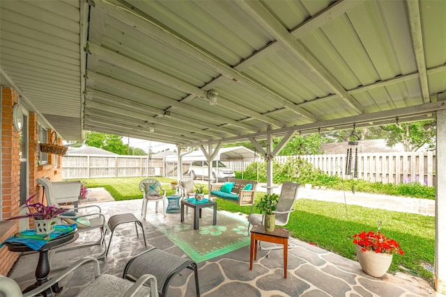 view of patio featuring a fenced backyard and an outdoor living space
