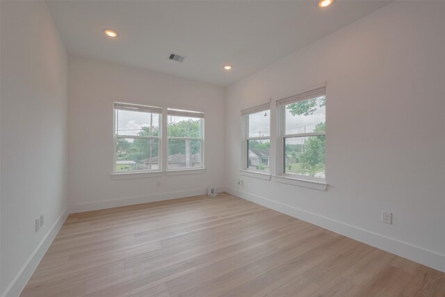empty room featuring recessed lighting, visible vents, and light wood-style flooring