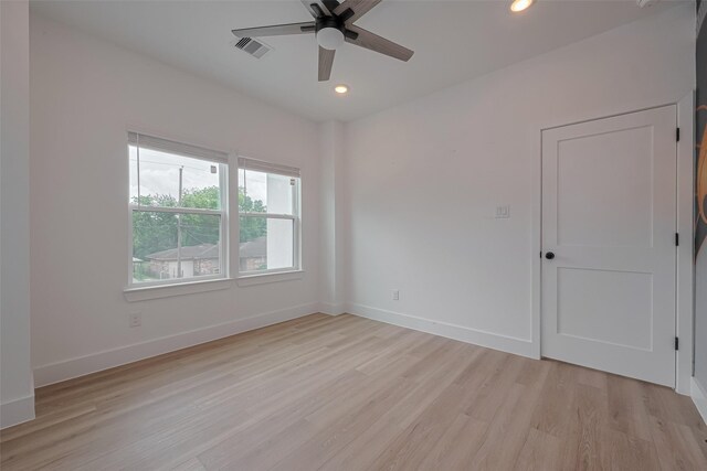 spare room with ceiling fan, light wood-style floors, recessed lighting, baseboards, and visible vents