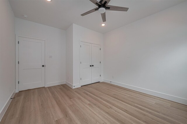 unfurnished bedroom featuring ceiling fan, recessed lighting, baseboards, light wood-type flooring, and a closet