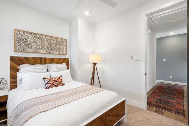 carpeted bedroom with recessed lighting, baseboards, ceiling fan, and attic access