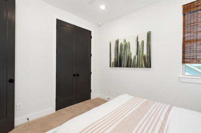 bedroom featuring baseboards, carpet, a closet, and recessed lighting