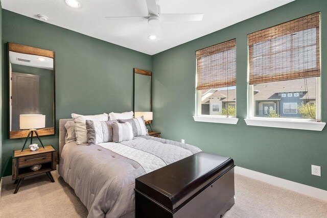 carpeted bedroom with baseboards, recessed lighting, and visible vents