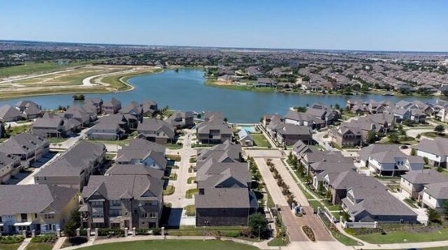 bird's eye view featuring a residential view and a water view
