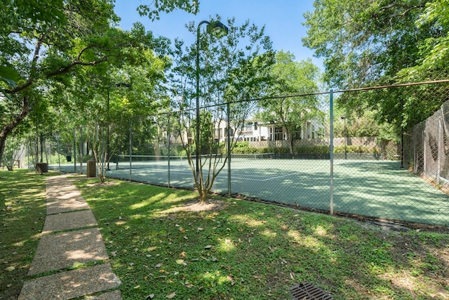 view of tennis court with fence