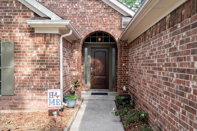 property entrance with brick siding