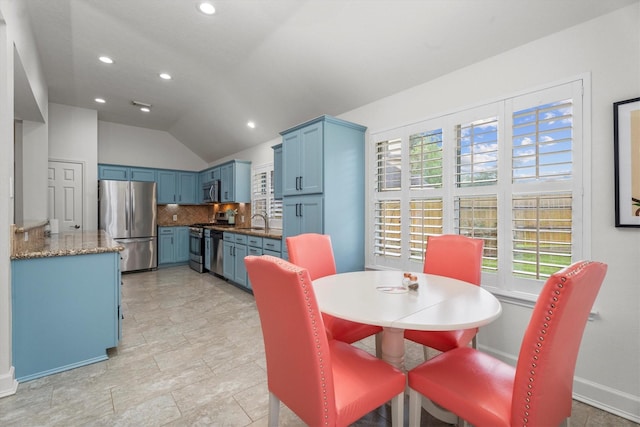dining area with recessed lighting, baseboards, and vaulted ceiling