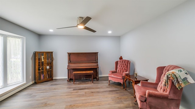 living area featuring ceiling fan, recessed lighting, and wood finished floors