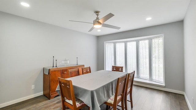 dining space with baseboards, ceiling fan, recessed lighting, and wood finished floors