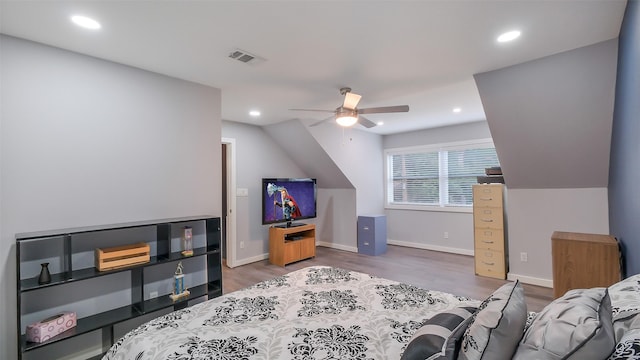 bedroom featuring recessed lighting, wood finished floors, and visible vents
