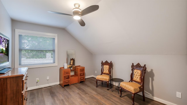 sitting room featuring baseboards, a ceiling fan, wood finished floors, and lofted ceiling