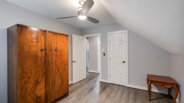 bonus room featuring baseboards, ceiling fan, wood finished floors, and lofted ceiling