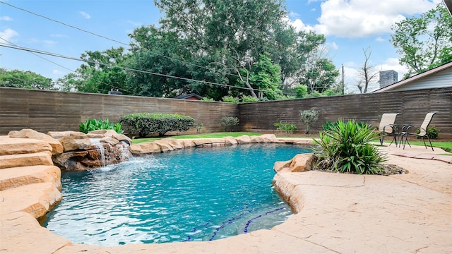 view of pool with a patio, a fenced in pool, and a fenced backyard