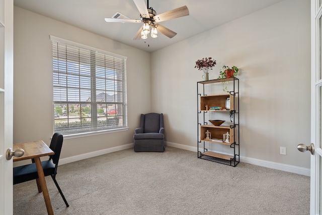 office space with baseboards, carpet flooring, and ceiling fan