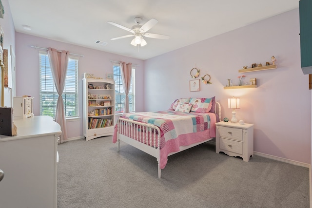 bedroom with light colored carpet, baseboards, visible vents, and multiple windows