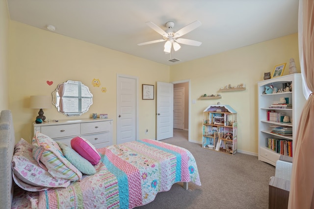 bedroom with baseboards, ceiling fan, visible vents, and light carpet