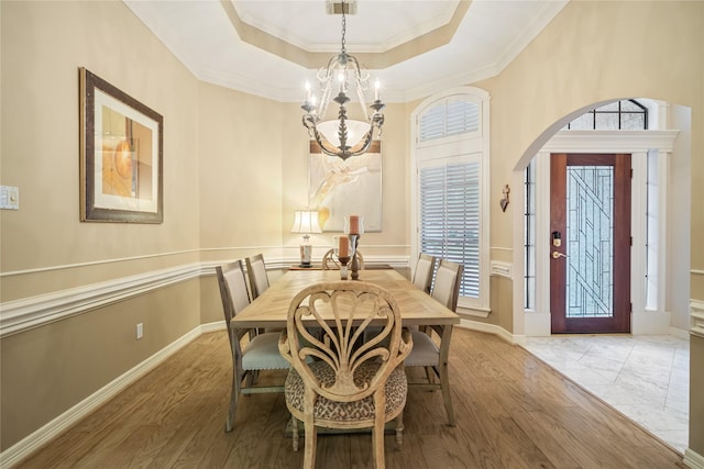 8010 Fonthill Dr, Spring, TX 77379 - dining area featuring arched walkways, plenty of natural light, and a chandelier