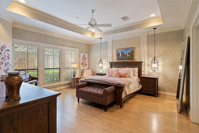 8010 Fonthill Dr, Spring, TX 77379 - bedroom featuring light wood-style floors, a raised ceiling, crown molding, and baseboards