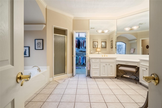 8010 Fonthill Dr, Spring, TX 77379 - bathroom with tile patterned flooring, vanity, a shower stall, ornamental molding, and a garden tub