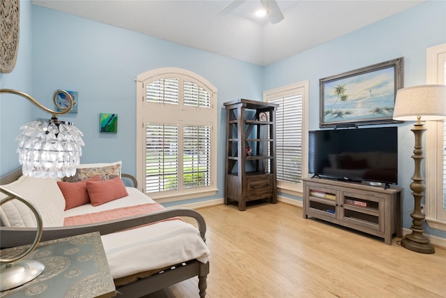 8010 Fonthill Dr, Spring, TX 77379 - bedroom featuring ceiling fan, baseboards, and light wood finished floors
