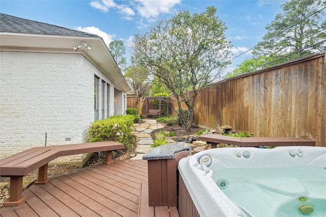 8010 Fonthill Dr, Spring, TX 77379 - wooden terrace featuring a hot tub, a fenced backyard, and area for grilling