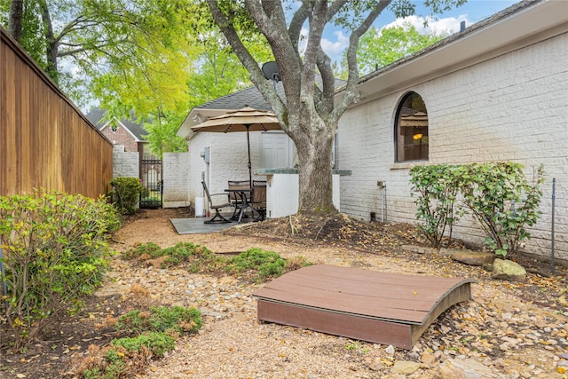 8010 Fonthill Dr, Spring, TX 77379 - view of yard featuring fence, a gate, and a patio area