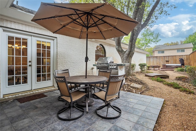 8010 Fonthill Dr, Spring, TX 77379 - view of patio / terrace with fence, french doors, and outdoor dining space