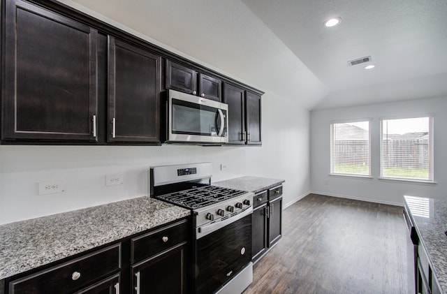kitchen featuring visible vents, wood finished floors, baseboards, recessed lighting, and appliances with stainless steel finishes