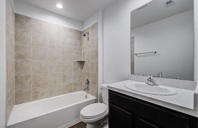 bathroom with visible vents, wood finished floors, vanity, toilet, and tub / shower combination