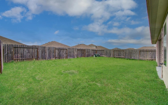 view of yard featuring a fenced backyard