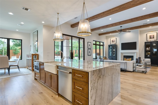 kitchen featuring a sink, plenty of natural light, visible vents, and appliances with stainless steel finishes