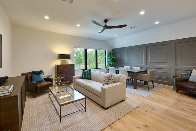 living area featuring light wood-style floors, visible vents, a ceiling fan, and recessed lighting