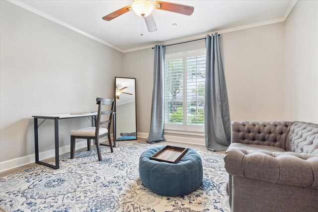 office area featuring crown molding, a ceiling fan, baseboards, and wood finished floors