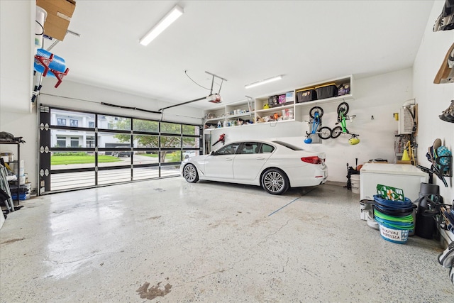 garage featuring a garage door opener