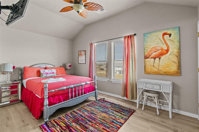 bedroom with a ceiling fan, baseboards, wood finished floors, and lofted ceiling