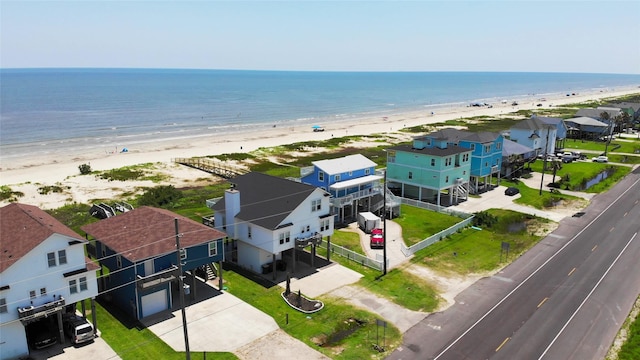 drone / aerial view with a water view and a view of the beach