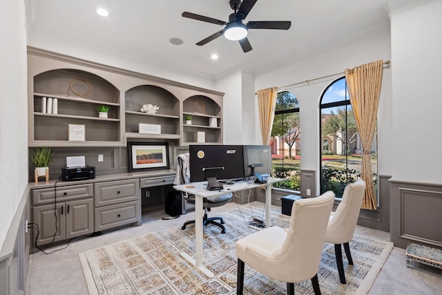 61 Open Sands Ct, Sugar Land, TX 77479 - office with ornamental molding, wainscoting, built in desk, built in shelves, and a ceiling fan