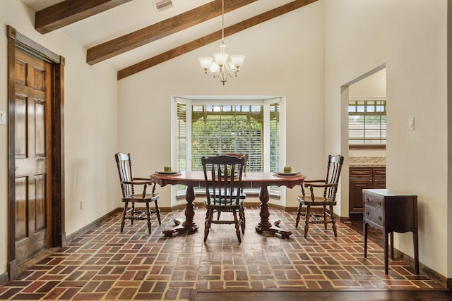dining room with visible vents, baseboards, and brick floor