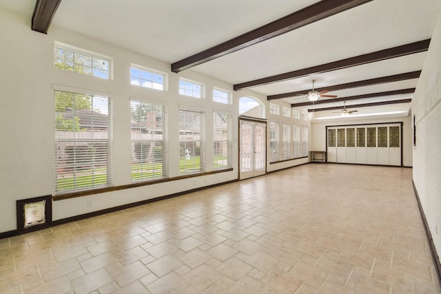 interior space featuring french doors and beam ceiling
