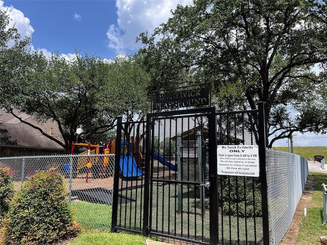 view of gate with fence