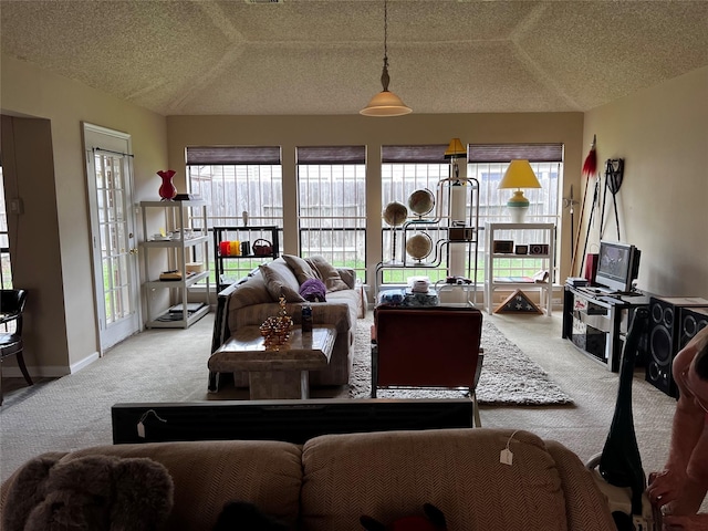 living room with baseboards, carpet flooring, and a textured ceiling