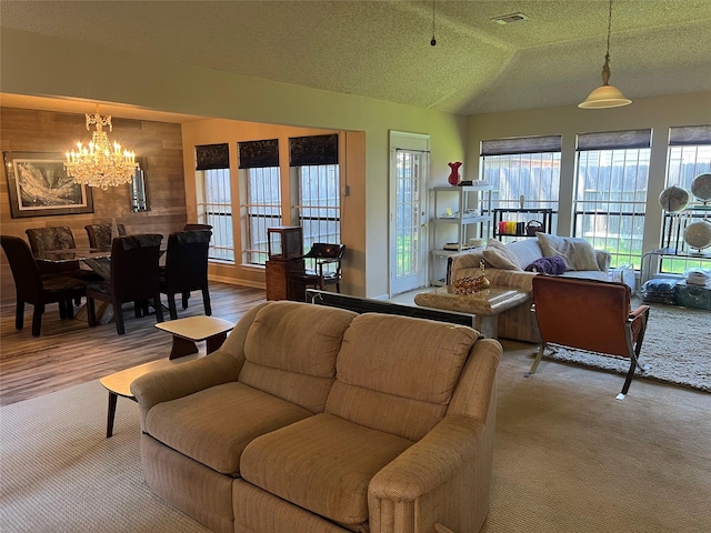 11726 Pecan Creek Dr, Houston, TX 77043 - living area featuring a chandelier, plenty of natural light, a textured ceiling, and vaulted ceiling