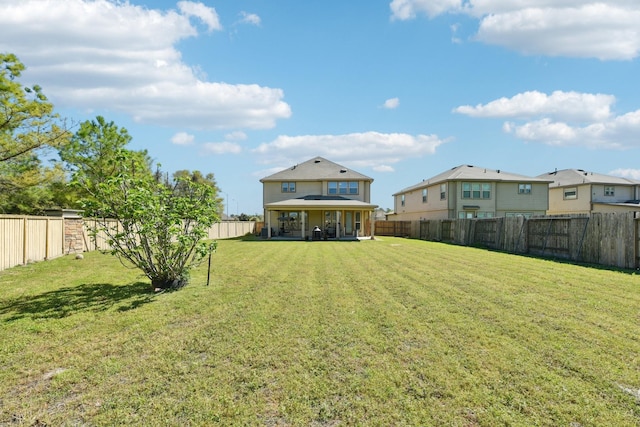 view of yard with a patio and a fenced backyard