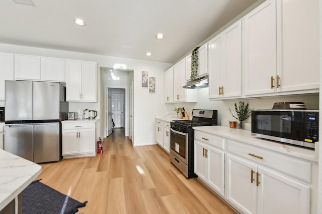 kitchen with light wood-style flooring, stainless steel appliances, recessed lighting, white cabinetry, and under cabinet range hood