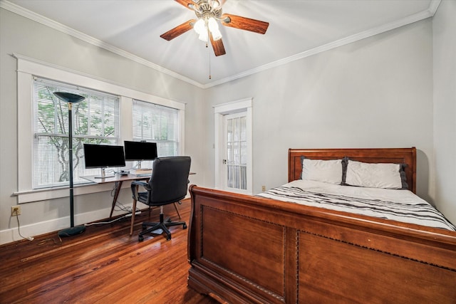 bedroom featuring crown molding, multiple windows, and wood finished floors