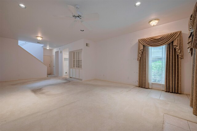 unfurnished living room with ceiling fan, light carpet, recessed lighting, and visible vents