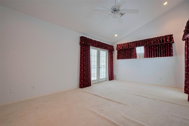 carpeted spare room with recessed lighting, ceiling fan, and high vaulted ceiling
