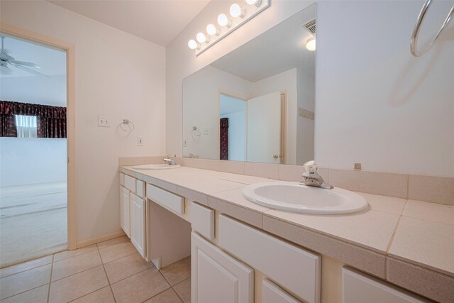 bathroom featuring a sink, tile patterned flooring, a ceiling fan, and double vanity